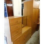 A light oak bedroom suite, comprising double wardrobe with cupboard top, bedside three drawer
