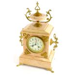 A French late 19thC pink marble mantel clock, with gilt metal mounts, the top with an urn finial abo