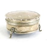 A George V small silver trinket box, the hinged lid with a piecrust border revealing a lined interio