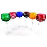 A harlequin set of six Bohemian style hock glasses, each with a cut coloured bowl.