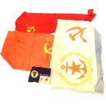 A collection of Russian flags, to include a ships pennant, an unusual flag with a gold wreath on a c