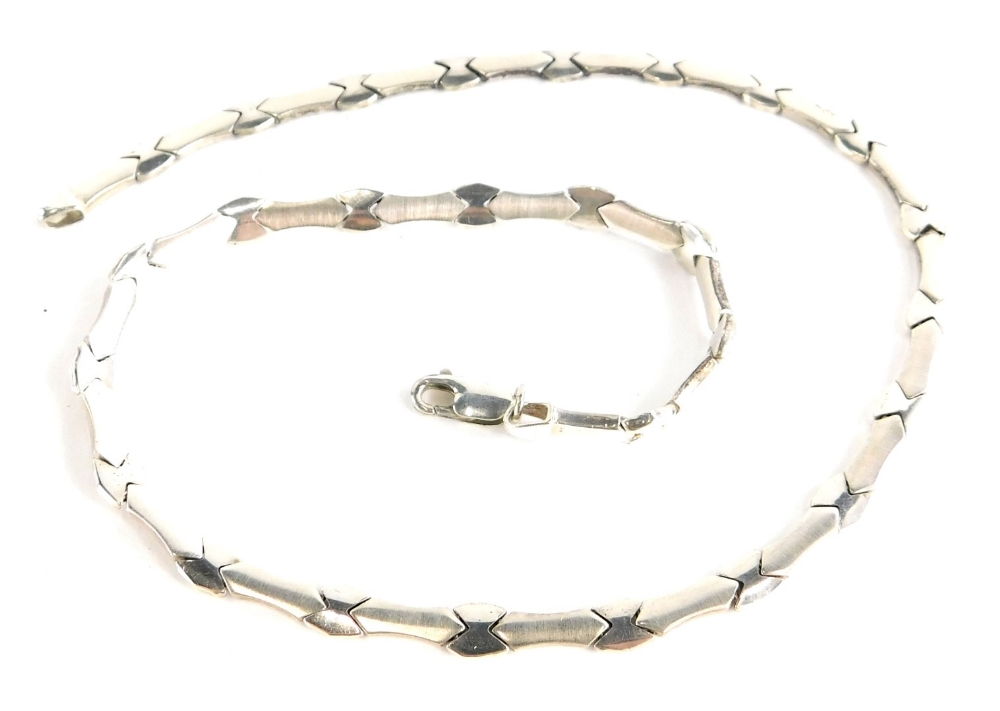 A sterling silver collar necklace, with brushed decoration and cross links, 44cm long, 16.1g all in.