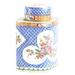 A continental porcelain lozenge shaped tea caddy and cover, decorated in oriental style wi