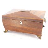 A mid 19thC mahogany and boxwood strung sarcophagus shaped workbox, the hinged lid enclosing a lined