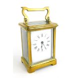 A French R and C brass carriage clock, the white enamel dial with Roman numerals, stamped made in Pa