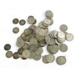 A quantity of British part silver and silver coins, to include pre 1977 sixpences, etc.