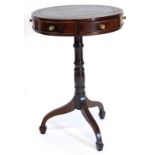 A mahogany drum top occasional table, with a leather top, turned column and spade feet, 45cm diamete