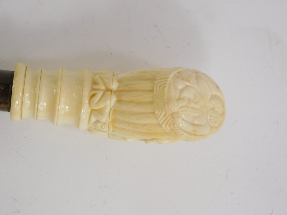 A late 19th/early 20thC walking cane, the bone handle carved with oriental figures, etc., above a si - Image 3 of 3