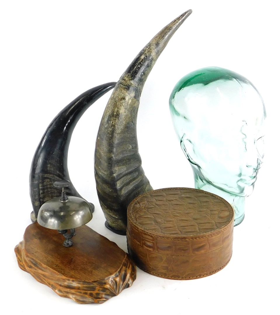 A moulded glass shop display head, 30cm high, a cast brass desk bell, leather collar box and two res