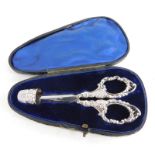 A Victorian silver mounted sewing set, comprising scissors and thimble, the thimble with marks for B