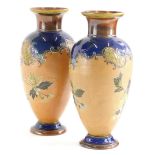 A pair of Royal Doulton Slaters patent vases, each with decoration of flowers and leaves within tube