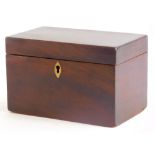 A George III mahogany tea caddy, of plain form, the hinged lid enclosing two lidded compartments, 19