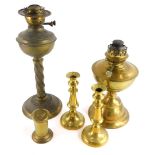 A late Victorian brass oil lamp, decorated with scrolls, etc., on a fluted base, another brass oil l