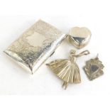 A collection of small silver, to include a Victorian silver cigarette case, decorated with scrolls,