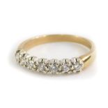 A 9ct gold half hoop eternity ring, set with seven round brilliant cut diamonds, in claw white gold