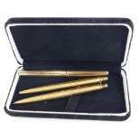 A Parker gold plated fountain pen, and two Parker ballpoints.