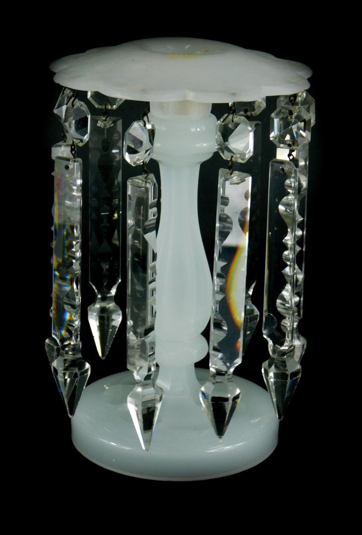 A late 19thC white opaque glass table lustre, with prismatic cut drops, (AF), 23cm high.