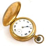 A continental gold plated hunter pocket watch, with engine turned decoration, the enamel dial with R