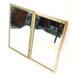 A pair of mottled gilt gesso wall mirrors, each with bevelled glass engraved with stars, 69cm high,
