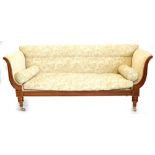 A William IV mahogany sofa, with leaf and scroll patterned upholstery, carved supports to the arms,