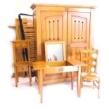 A French pine bedroom suite, comprising two door wardrobe with pierced panelled doors, enclosing she