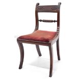 A Regency mahogany side chair, with a rope twist back scroll carved back supports, and a drop in sea