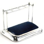 An Edwardian silver novelty hat pin stand, modelled in the form of an umbrella stand, with blue velv