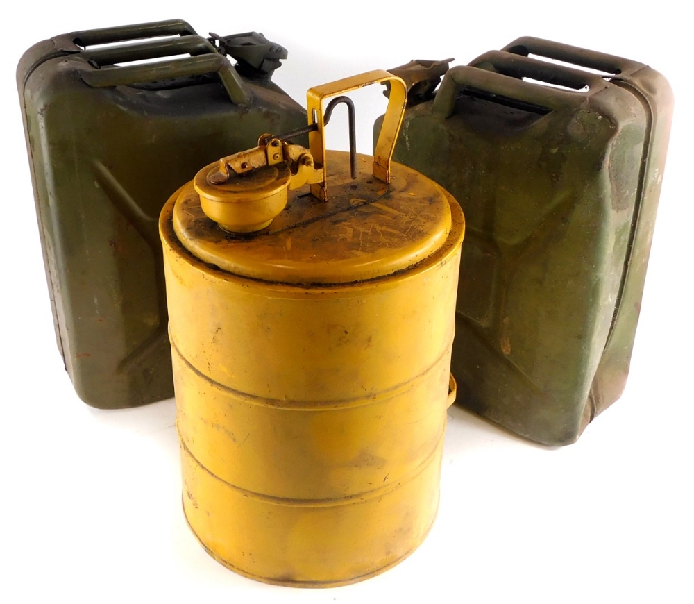 A yellow painted petrol tank, possibly military issue, and two military issue green painted petrol t