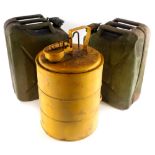 A yellow painted petrol tank, possibly military issue, and two military issue green painted petrol t