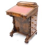 A Victorian walnut and marquetry Davenport, the hinged top with a fitted interior for letters, etc.,