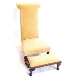 A Victorian mahogany prie dieu chair, upholstered in beige pattern fabric on turned legs with castor