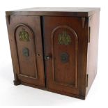 An unusual late early 19th/early 20thC mahogany stationery cabinet, modelled in the form of a safe.