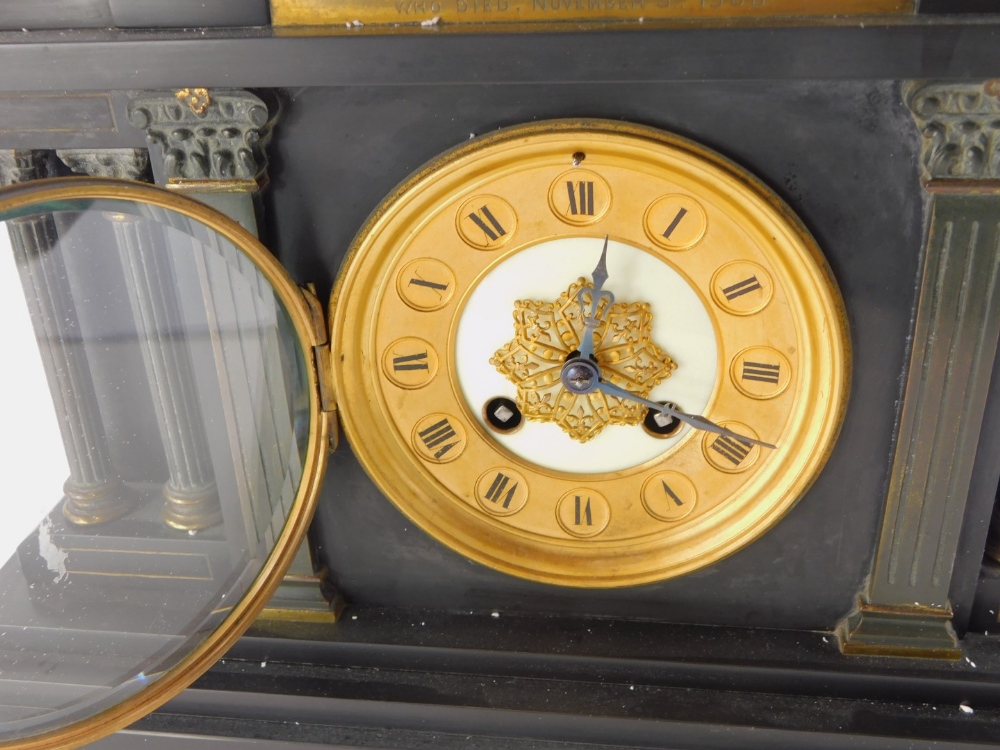 A late 19thC/early 20thC French black slate portico shaped mantel clock, with reeded Corinthian colu - Image 2 of 4