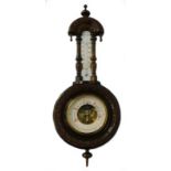 A Victorian walnut cased aneroid barometer, with carved case and ceramic thermometer, 55cm high.