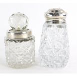 Two cut glass dressing table jars, one with a cut glass stopper and silver collar, engraved with the