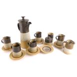 A Studio pottery coffee service, decorated with bands and shades of brown, to include coffee pot and