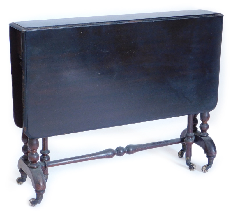 A late Victorian ebonised mahogany Sutherland table, the rectangular top with a moulded edge and rou