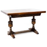 An oak draw leaf extending dining table, in Tudor style, the rectangular top above a carved frieze o