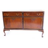 An early 20thC mahogany sideboard, the top with a moulded edge above two frieze drawers, surrounded