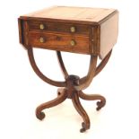 A Regency rosewood work table, the rectangular crossbanded top drop leaf top with canted corners abo