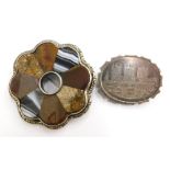 Two silver brooches, to include an oval silver brooch depicting Lincoln Cathedral, 4cm wide, togethe