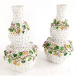 A pair of continental porcelain double gourd shaped vases, each with flower encrusted decoration, bl