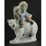 A Lladro porcelain figure, of two Eskimo children riding a polar bear, impressed number to underside