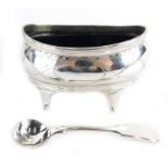 A George III silver salt, of oval form with reeded edges and bright cut pendant husk decoration, on