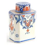 A French faience tea caddy and lid, decorated with scrolls, fans, flowers, etc., in iron red and blu