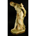 A Royal Worcester porcelain figure of Bather Surprised, modelled beside a tree stump on a canted rec