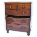 A Victorian mahogany bowfronted chest of drawers, the top with a moulded edge above an arrangement o