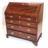 A 19thC mahogany pine and oak bureau, the fall with a satinwood band, enclosing a fitted interior ab