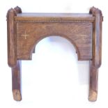 An ecclesiastical oak bracket, with faceted end supports, adapted, 49cm wide.