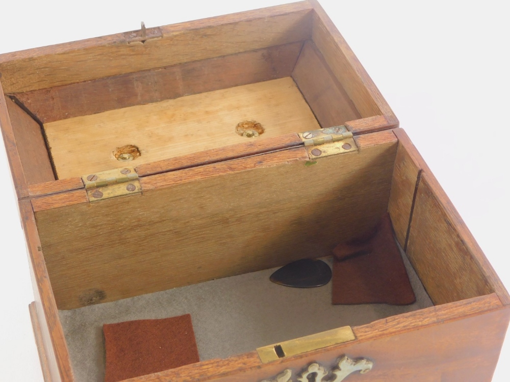 A George III mahogany tea caddy, the domed lid with a brass swing handle, enclosing a vacant interio - Image 2 of 2